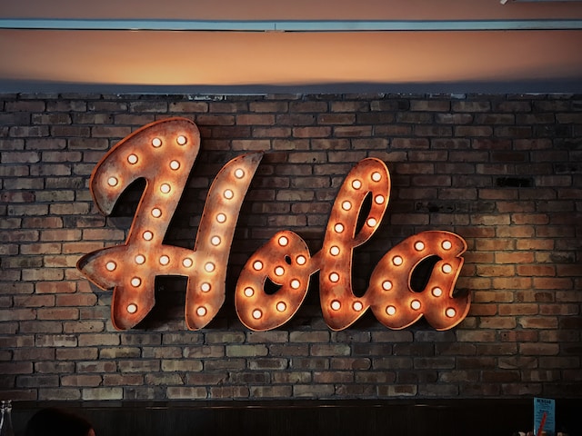 Greeting 'Hello' in Spanish displayed on a sign