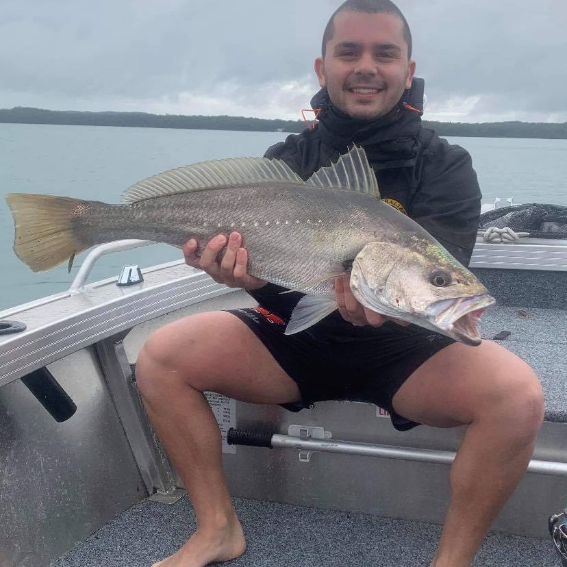 Matt the owner holding a fish
