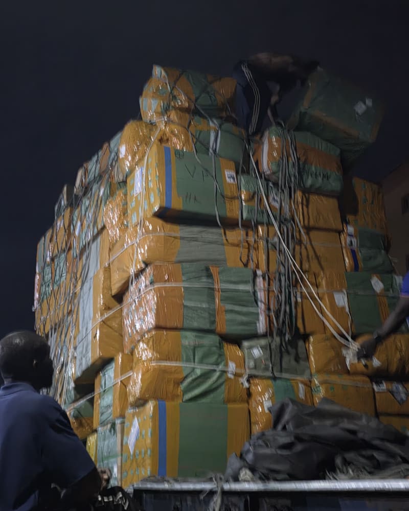 Consolidated cargo, wrapped and strapped together on a truck