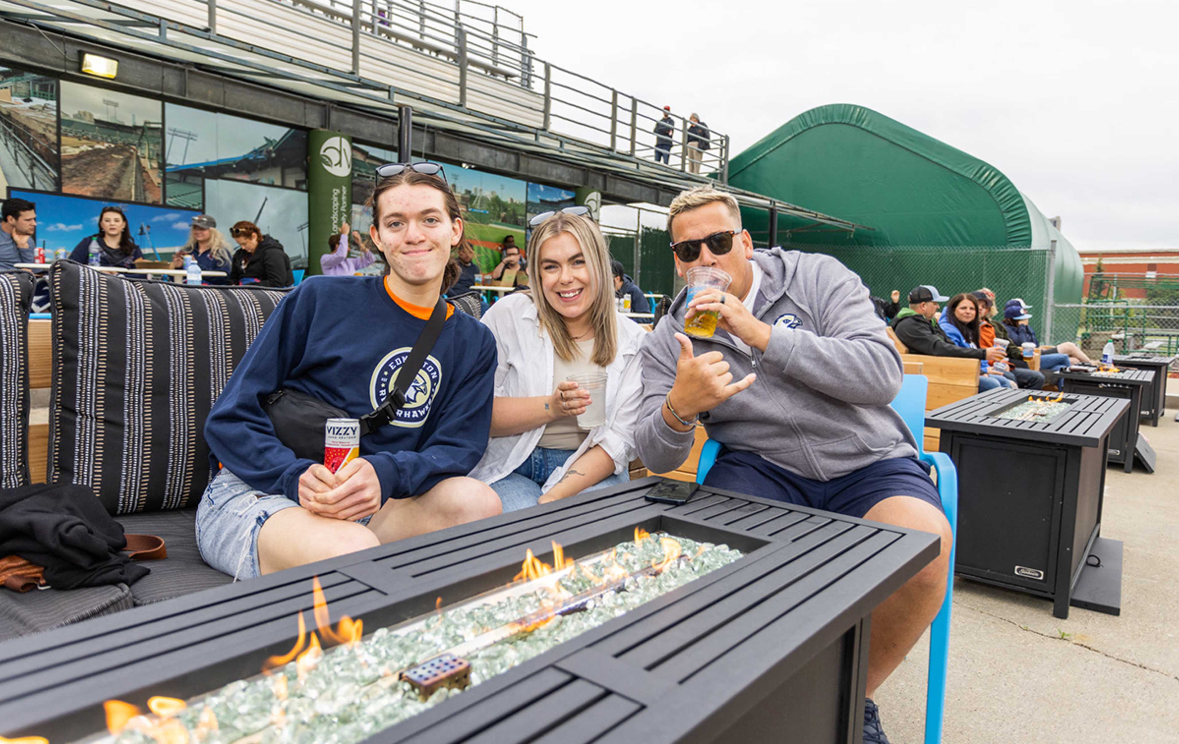 Fans sitting at DVP couch in front of fire table