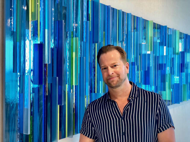 Michael Curry in front of WatercolorWaterCoolerWater Michael Curry