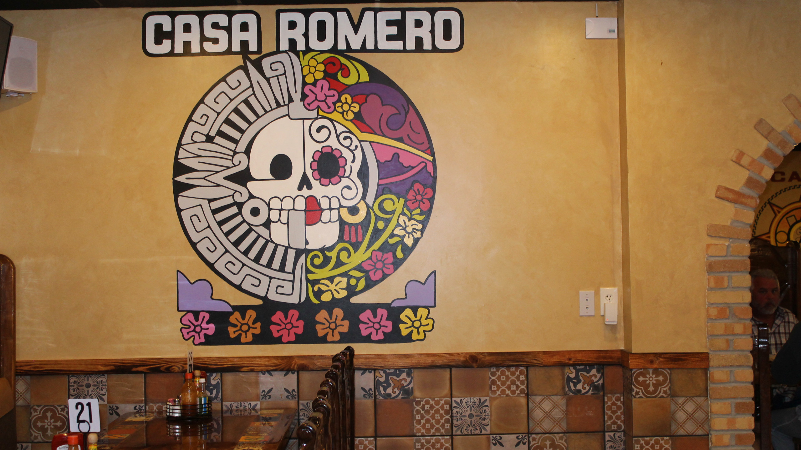 Casa Romero floral and skull circle painting