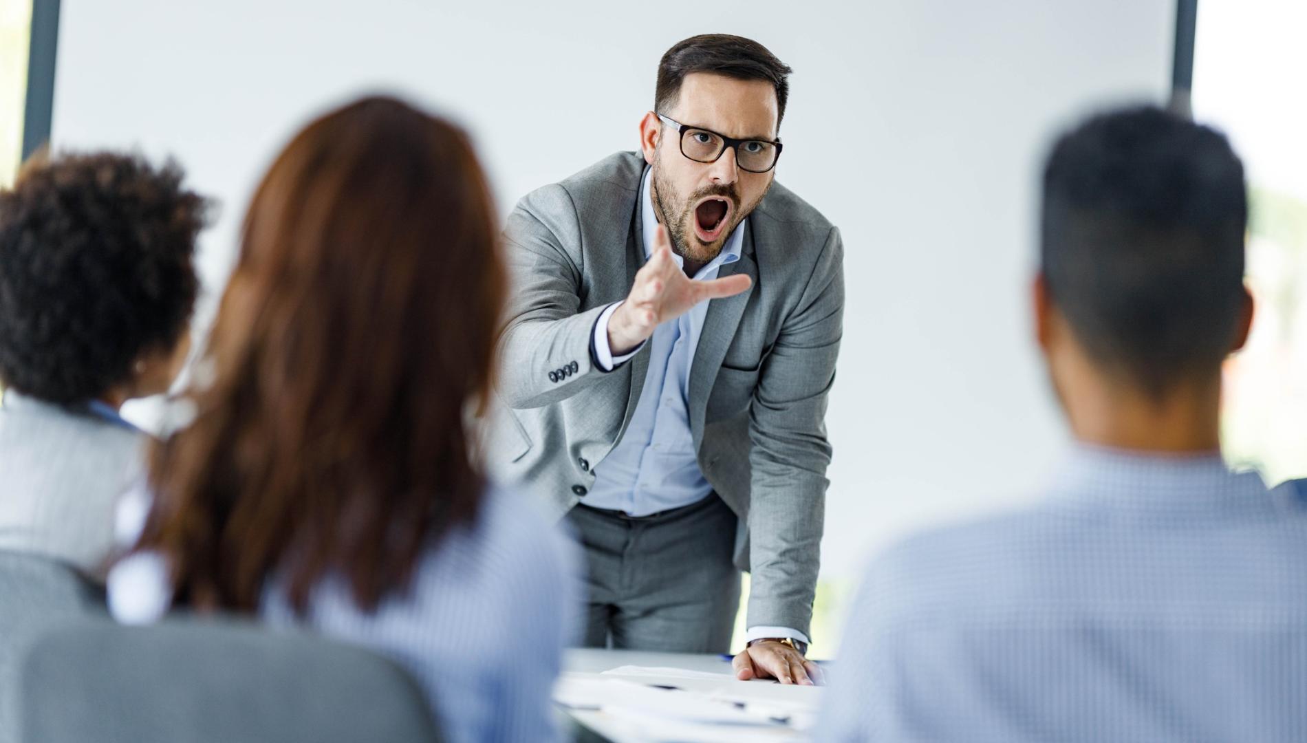 Angry CEO arguing with his colleagues on a presentation in the office