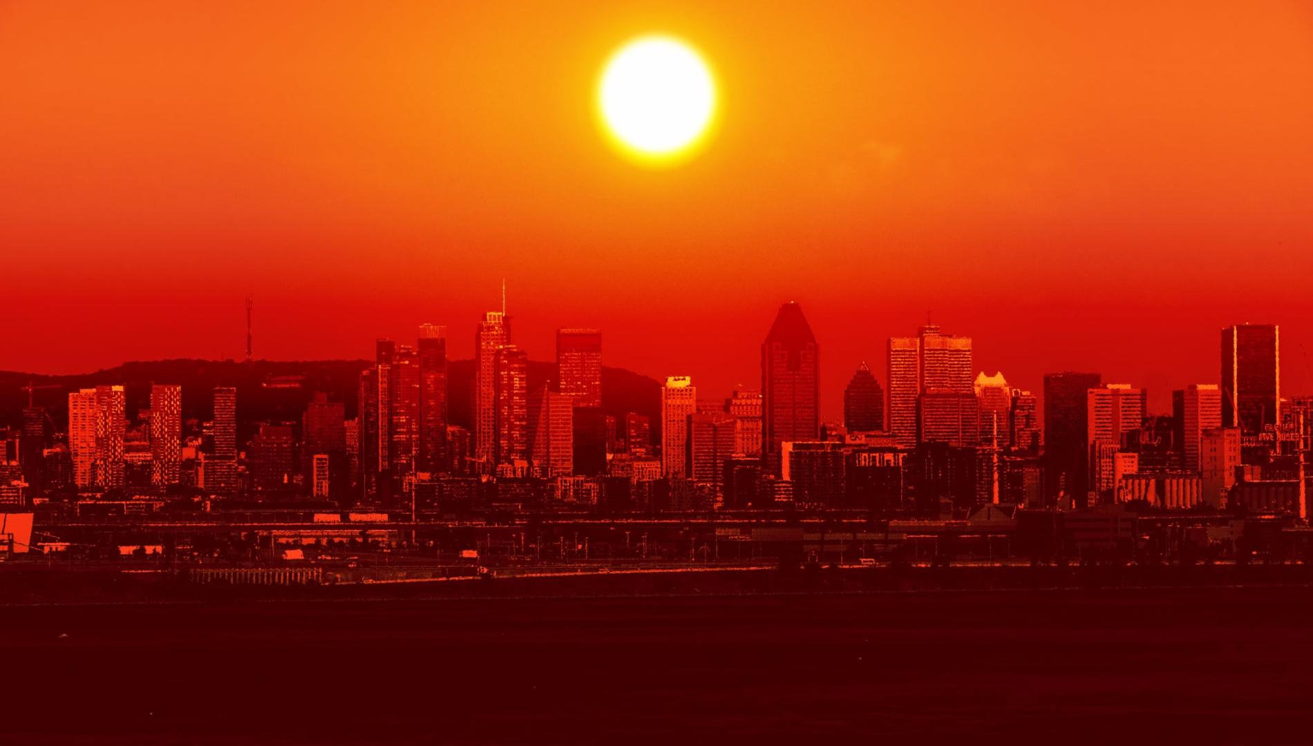 Conceptual image of a cityscape hit by an extreme heatwave with the sun hovering over it