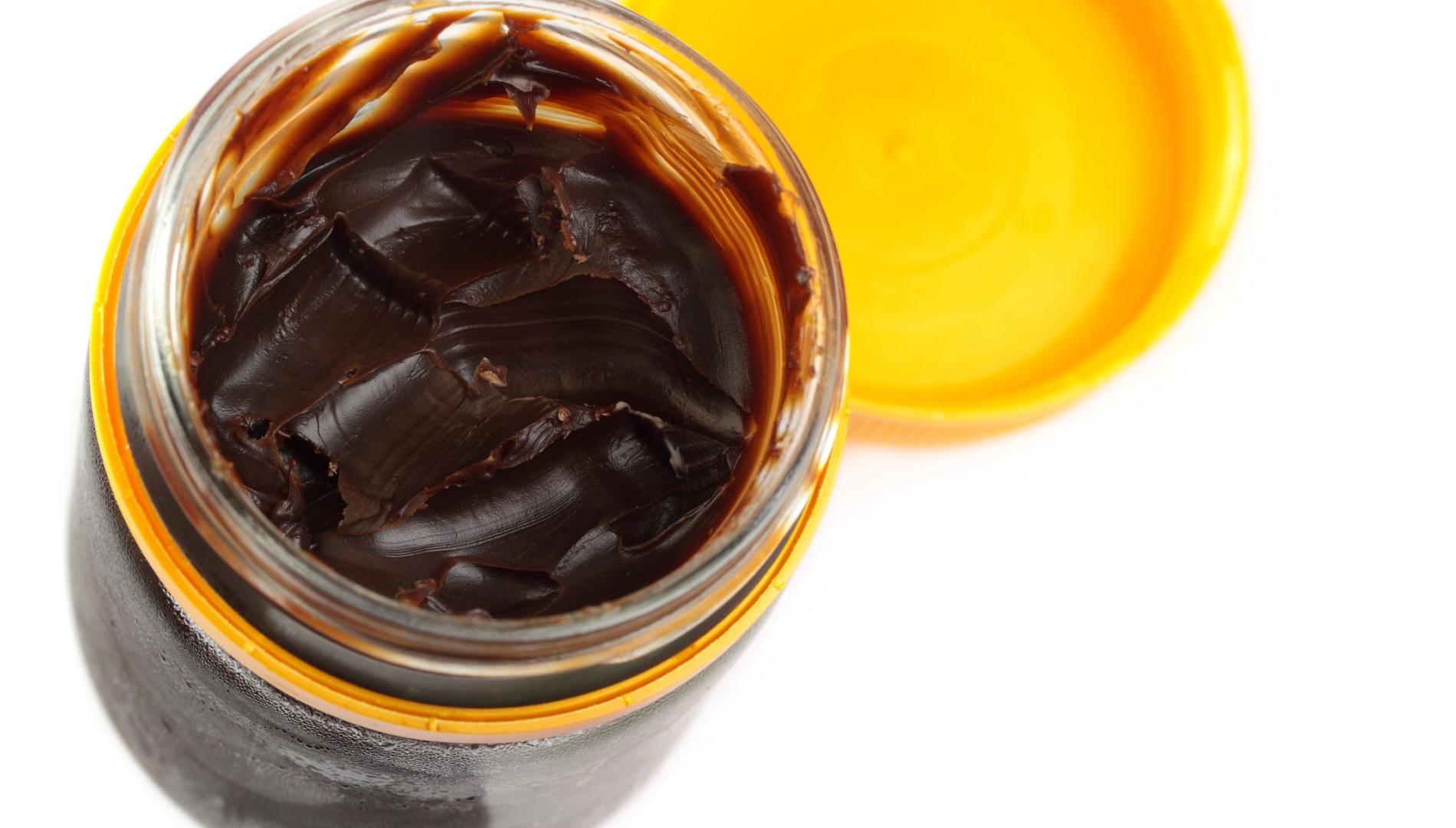 Open jar of Vegemite, photographed from above