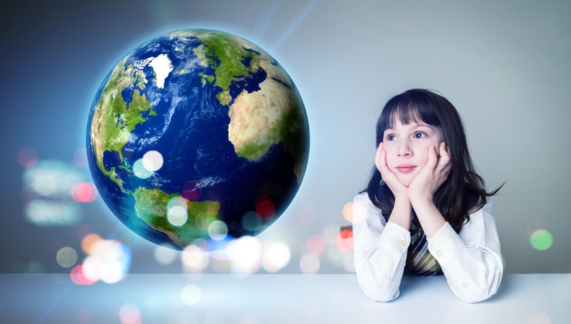 A young girl sits at a desk with her head in her hands looking wistfully towards Earth.