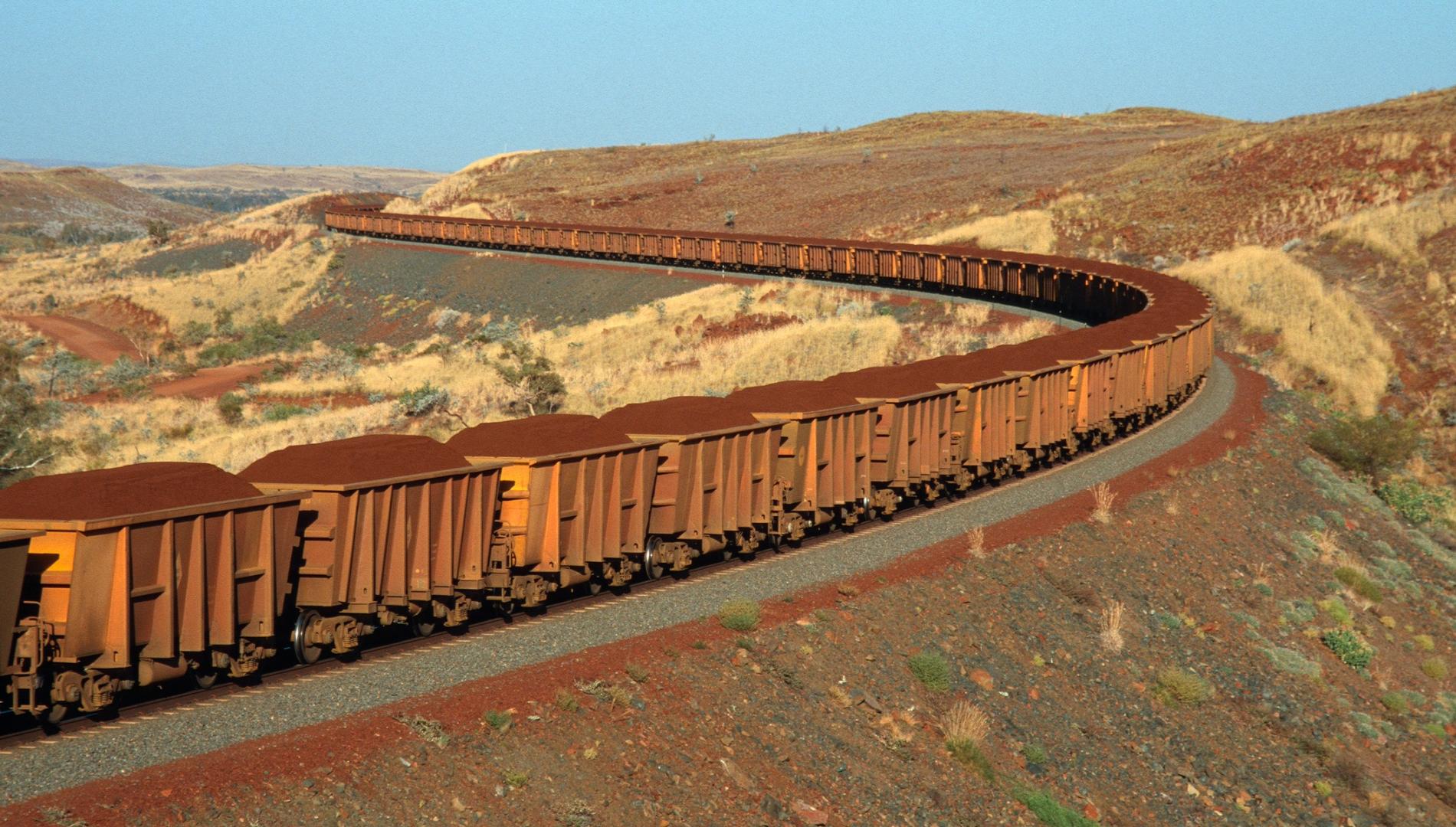 Iron ore on the move on a train from mine to port