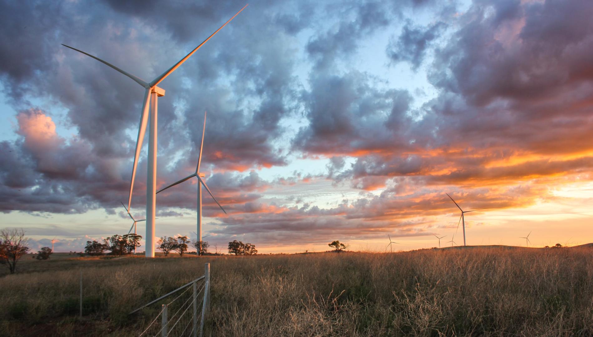 Wind turbines with clouds and sunset sky 