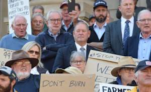 Protestors rally against government's "callous" levy