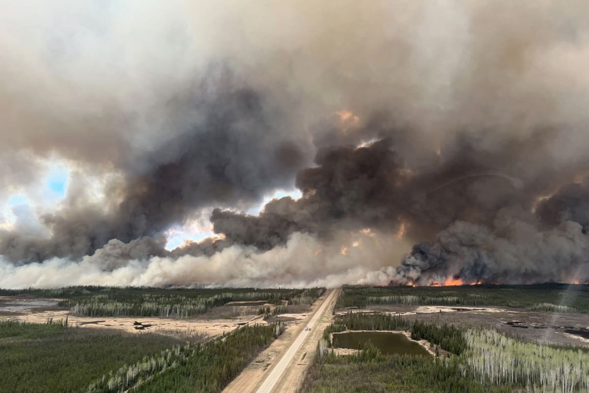 Oil town evacuated as fire rages