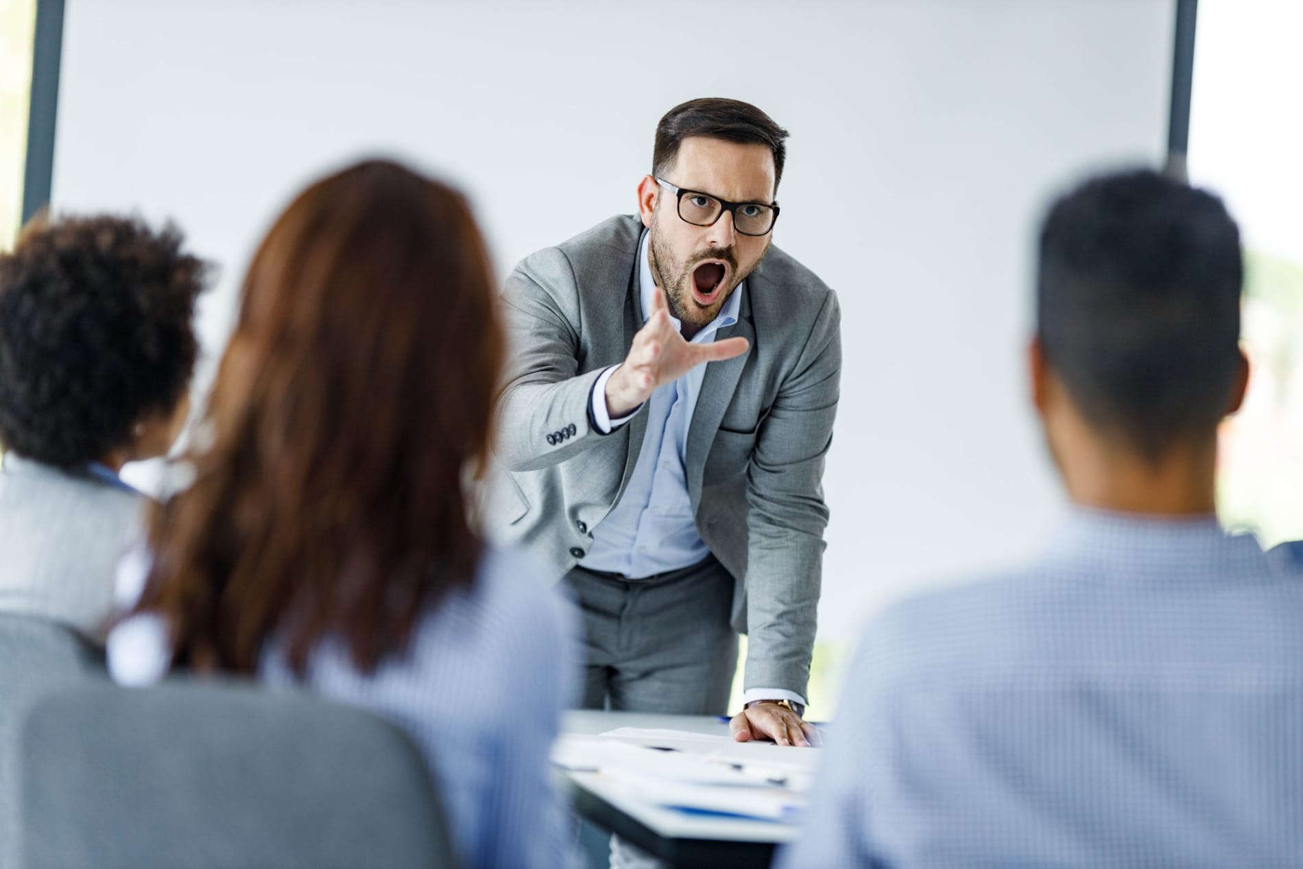 Angry CEO arguing with his colleagues on a presentation in the office