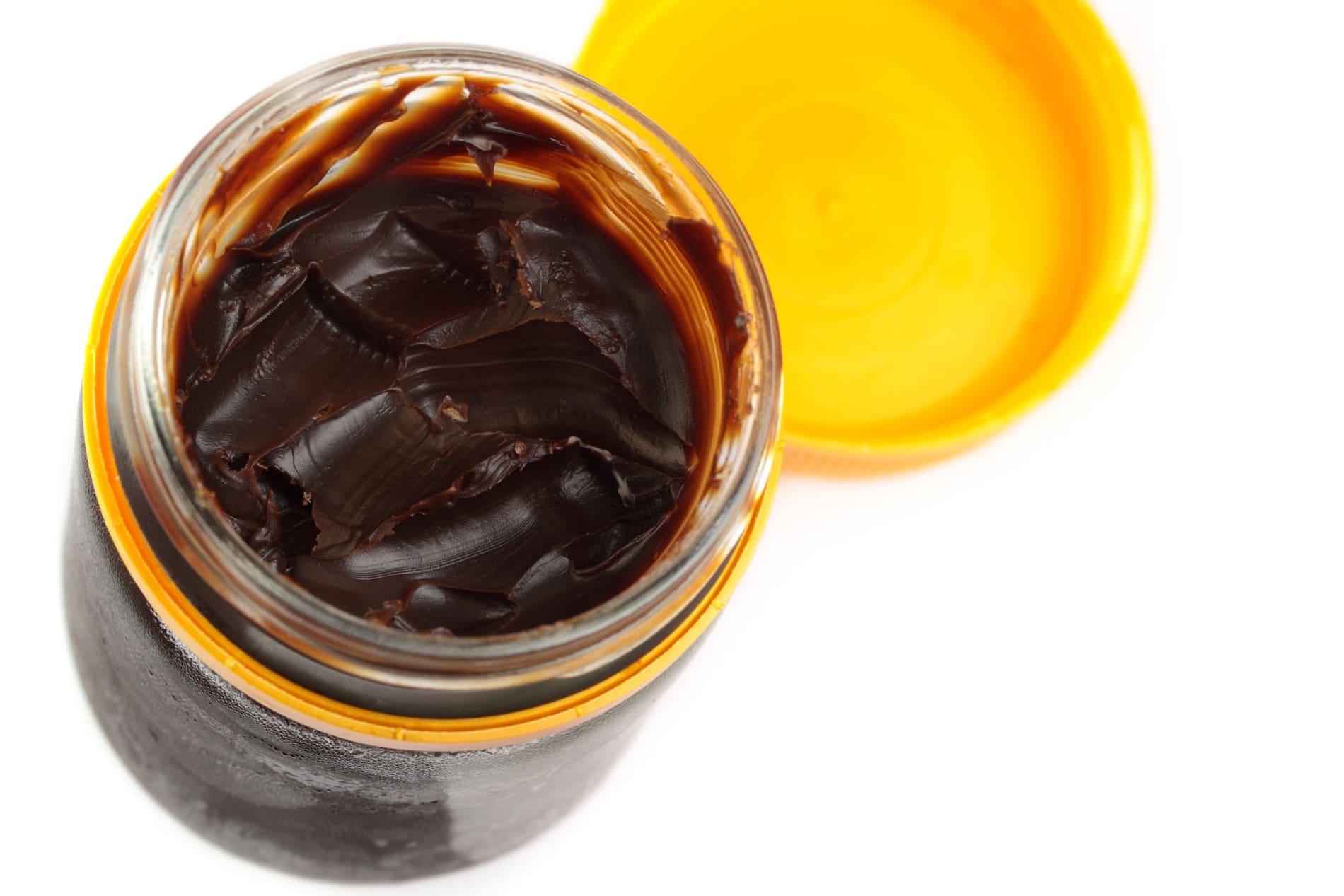 Open jar of Vegemite, photographed from above