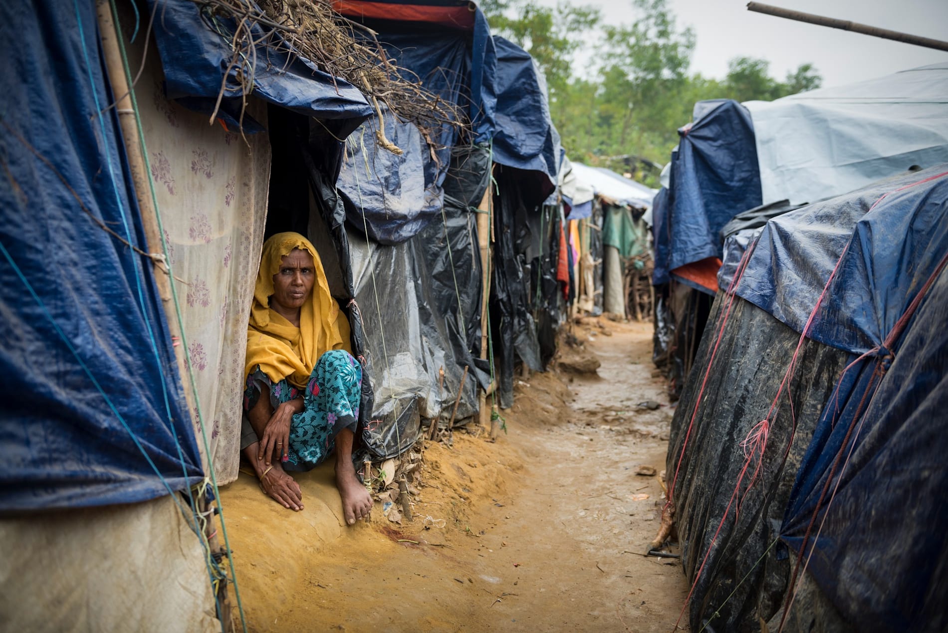 Rohingya woman and shelters at Kutupalong refugee camp in Bangladesh 