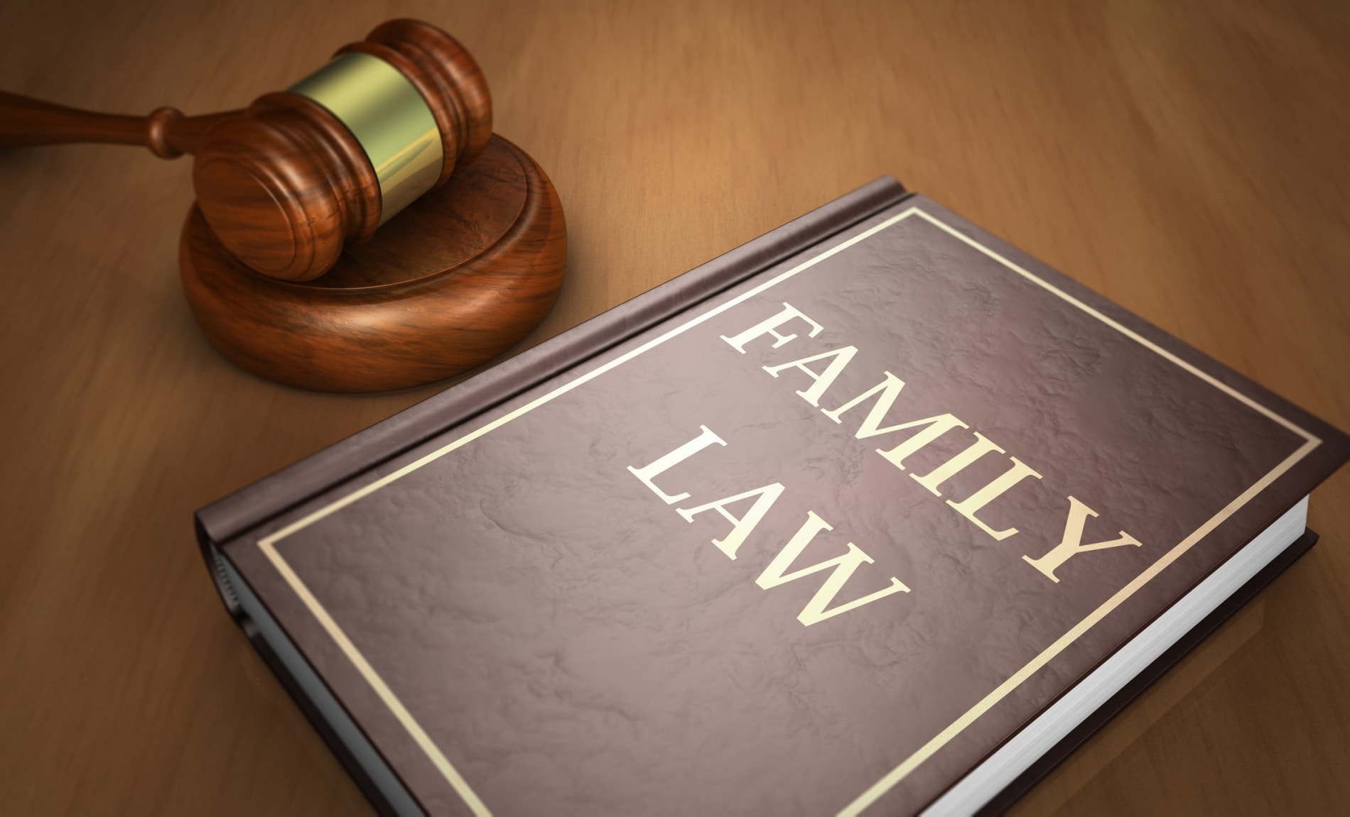 A book with 'Family Law' on the cover, and a gavel on a wooden desk