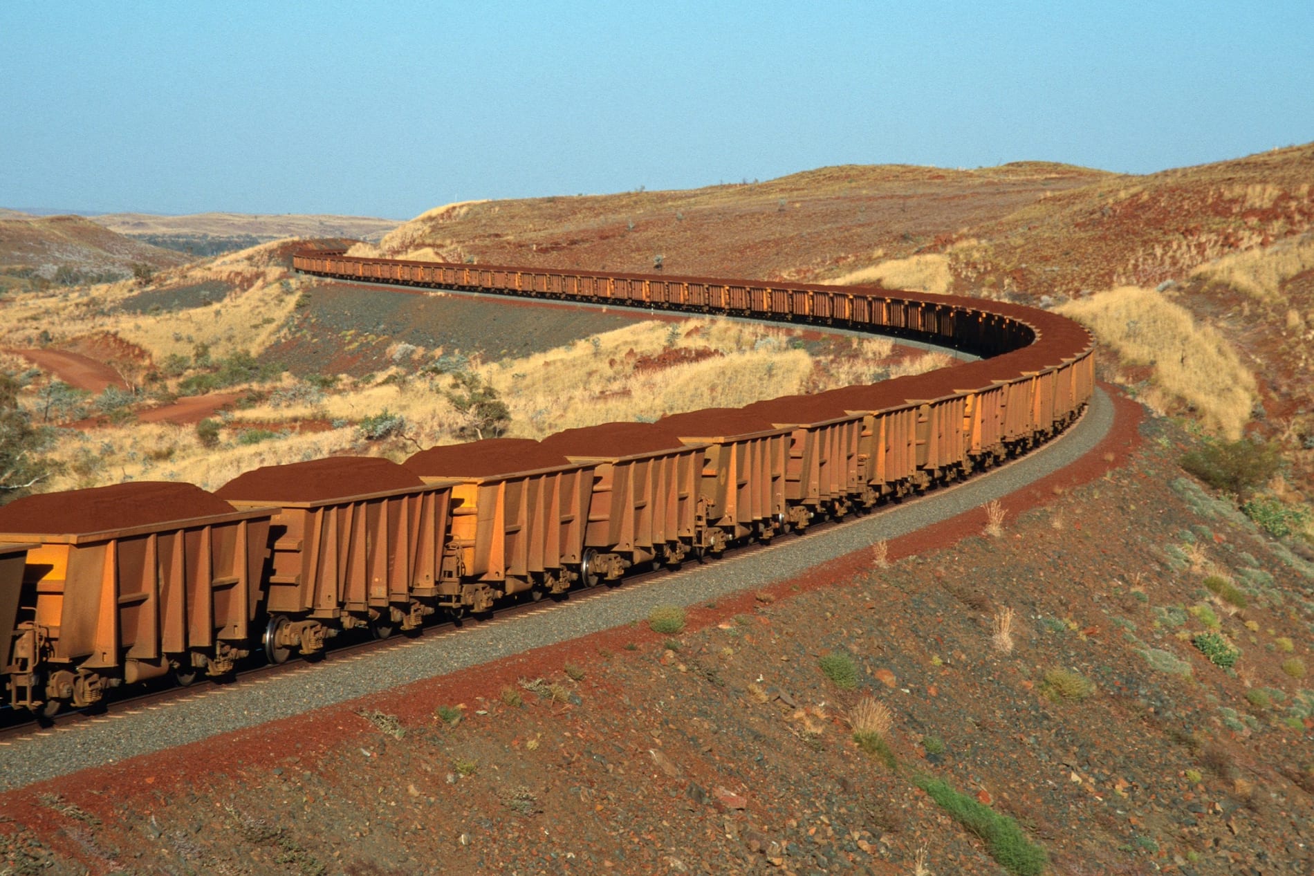 Iron ore on the move on a train from mine to port