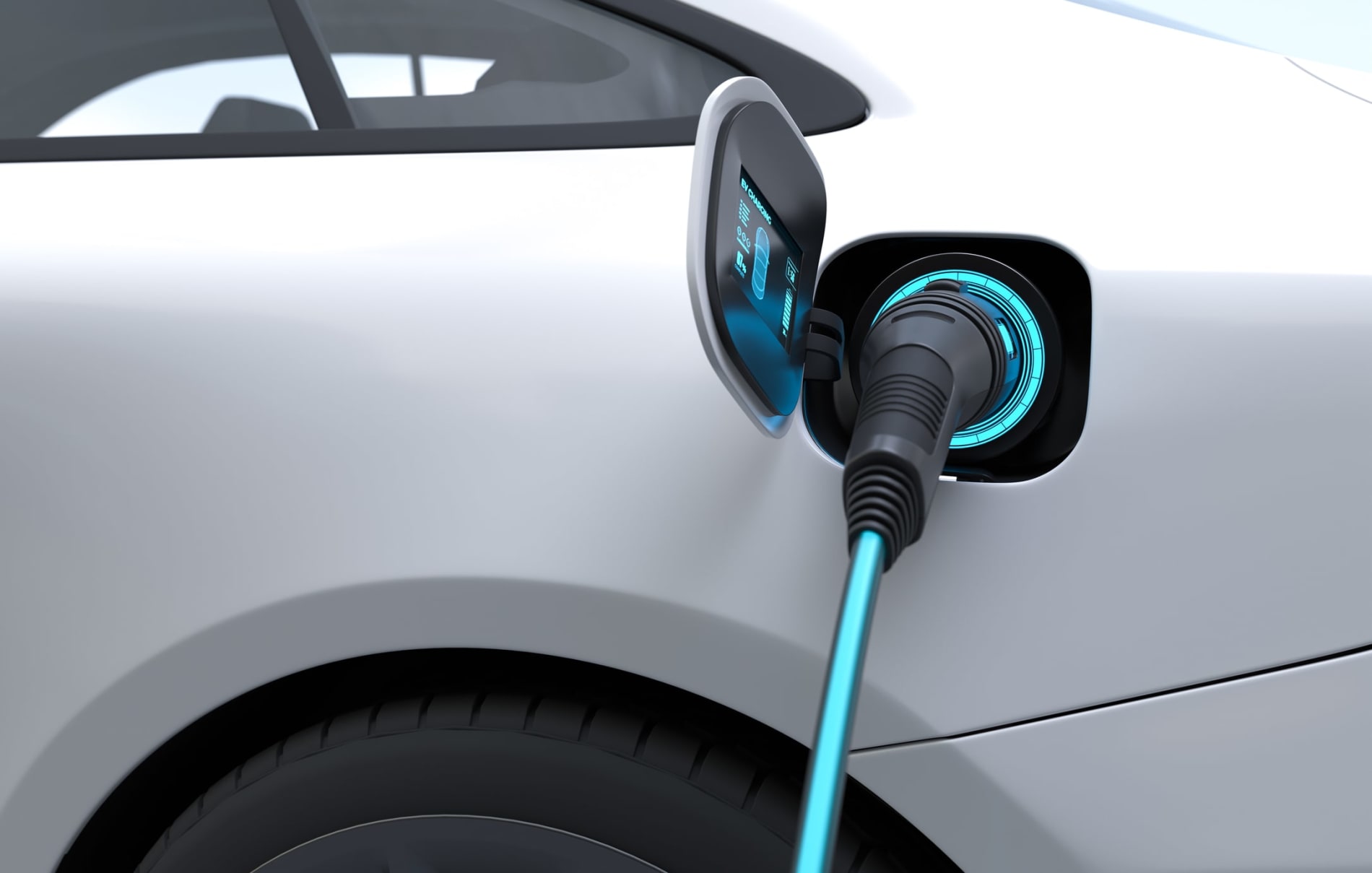 A white electric vehicle \being charged by a power cable