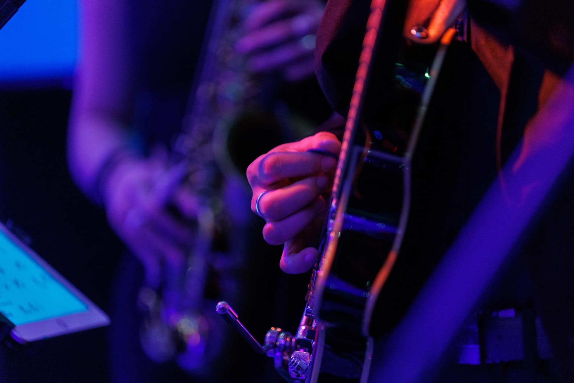 Close-up of a guitarist playing live