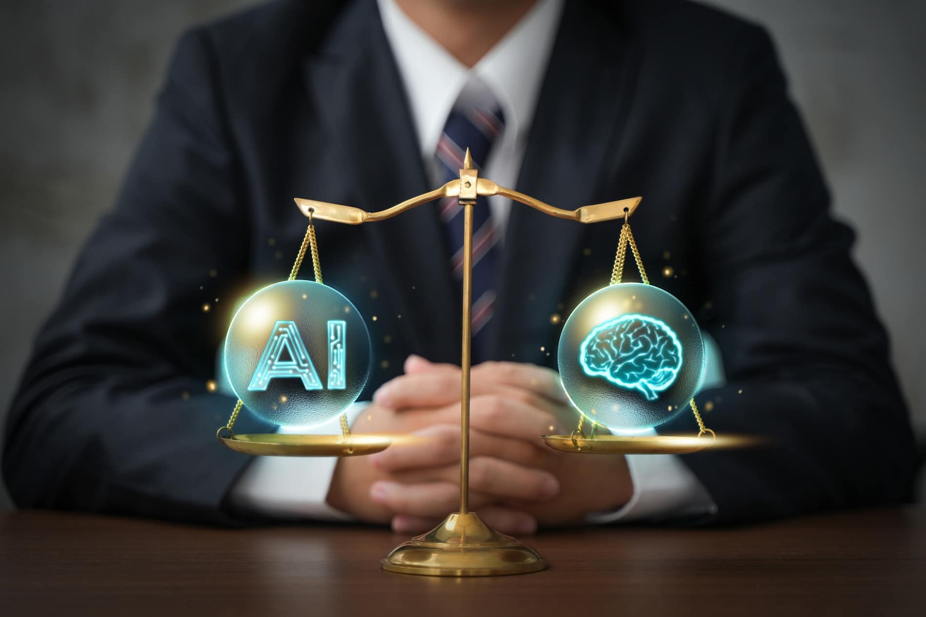 Scales of justice with image of a brain on one side and a brain the other. Businessman sitting in the background with his hands clasped resting on a desk.