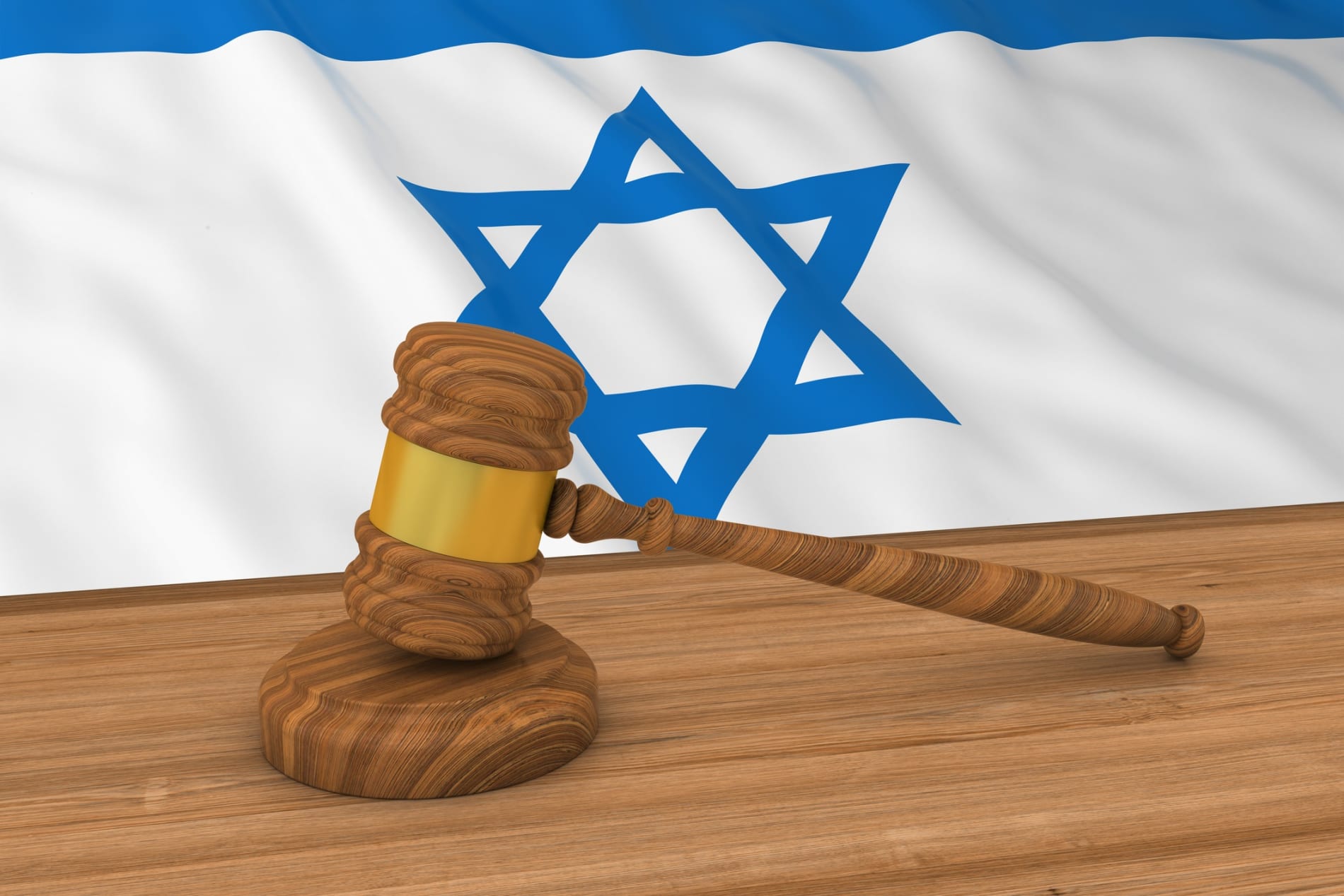 Israeli law concept - Flag of Israel behind judge's gavel.