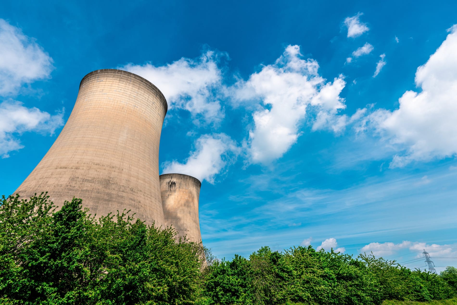 Nuclear cooling towers against a blue sky