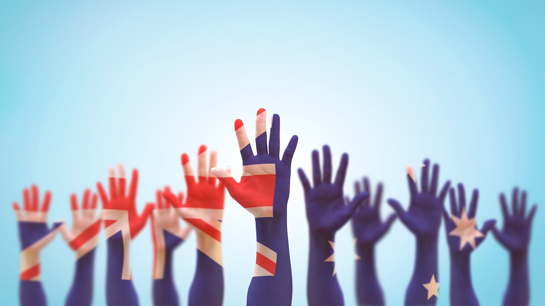 Show of hands painted to represent the Australian flag.