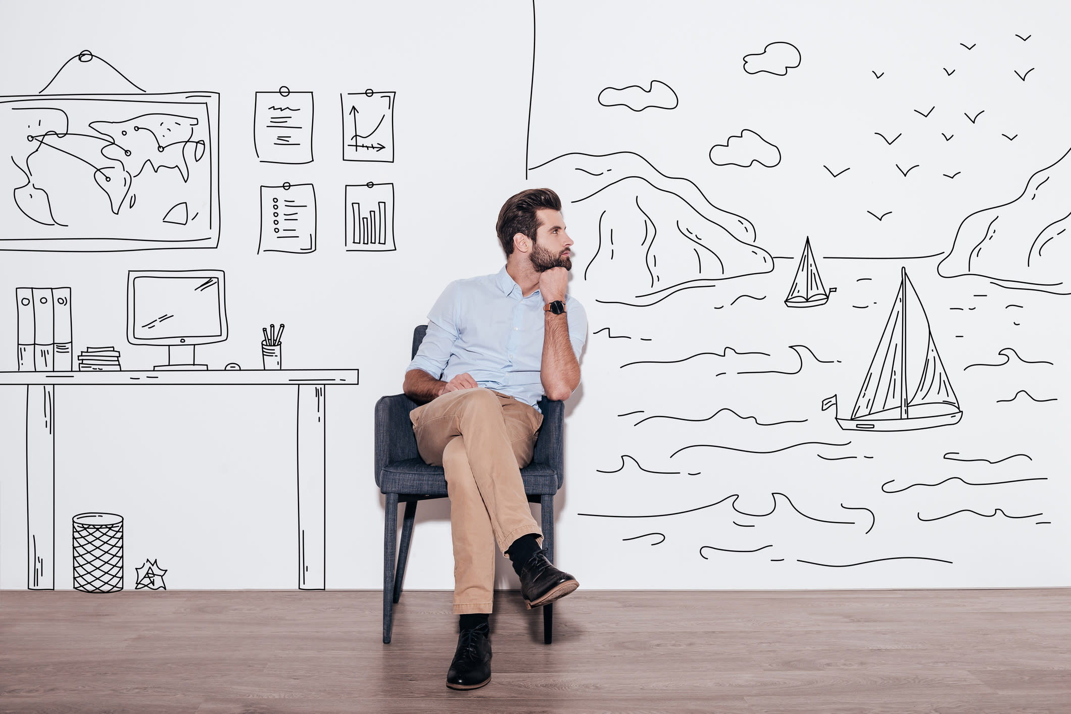 Man sitting in a chair with his mind wondering.