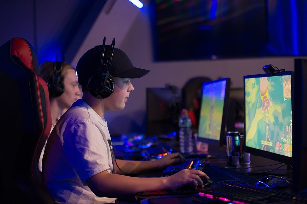 kid playing computer game esports