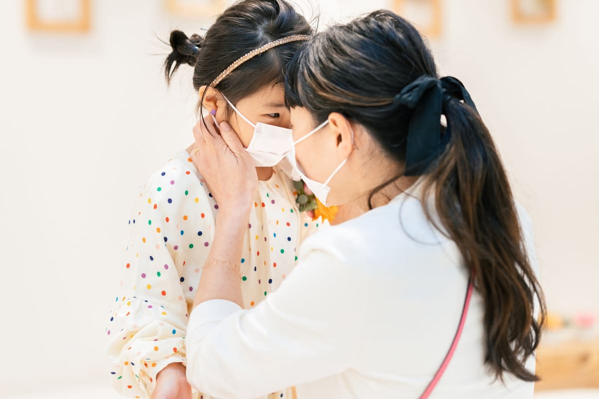 Mother and child wearing face masks