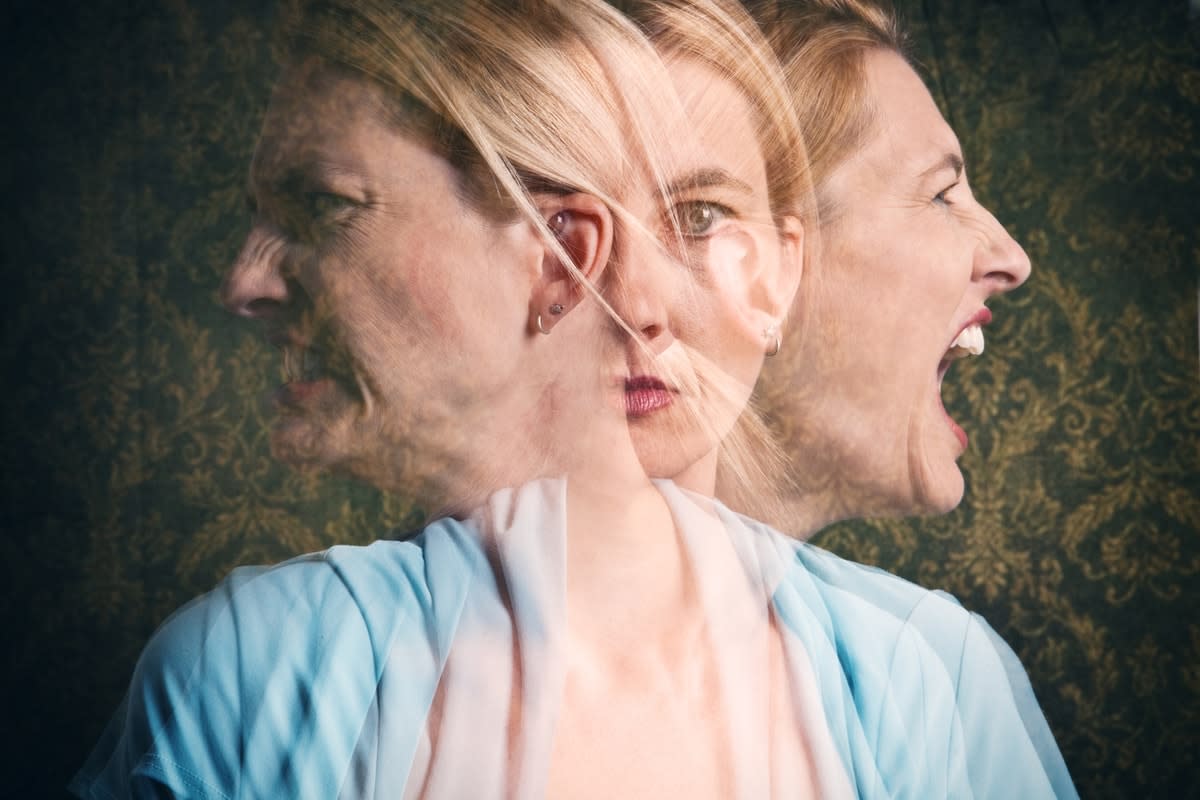 Three blurred faces of the same woman undergoing mental turmoil