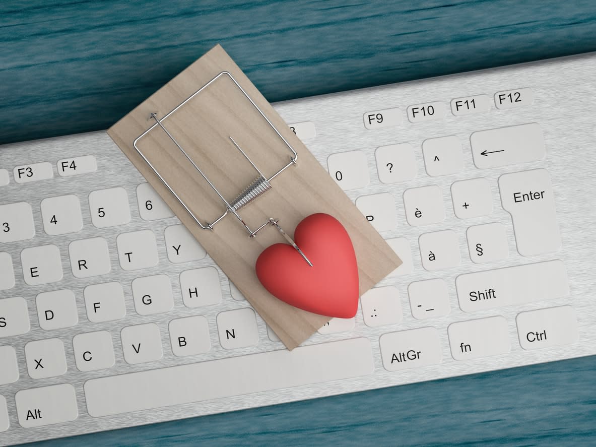 A love heart in a mousetrap sitting on a computer keyboard