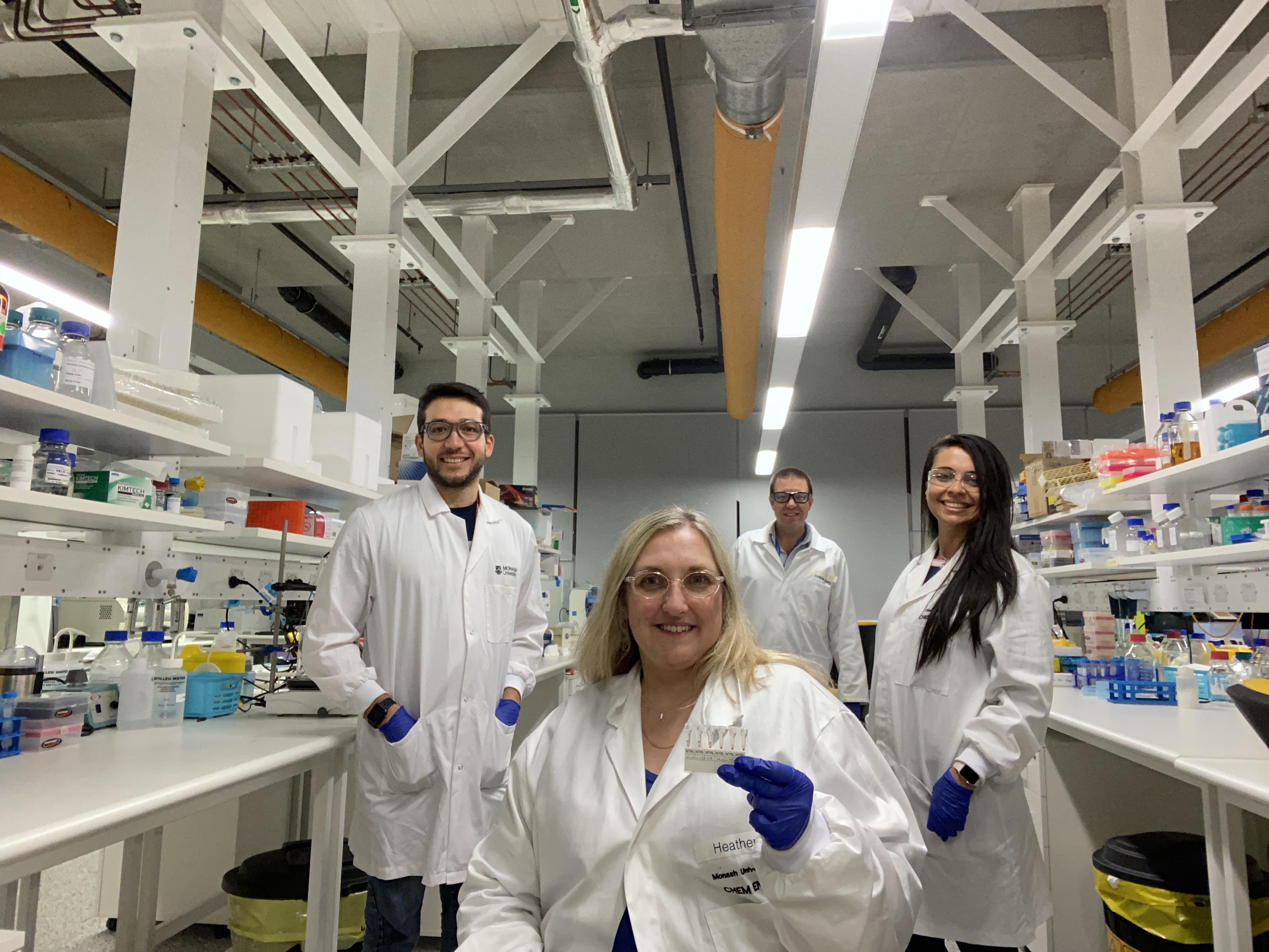 PhD students in the lab with supervisor Dr Simon Corrie