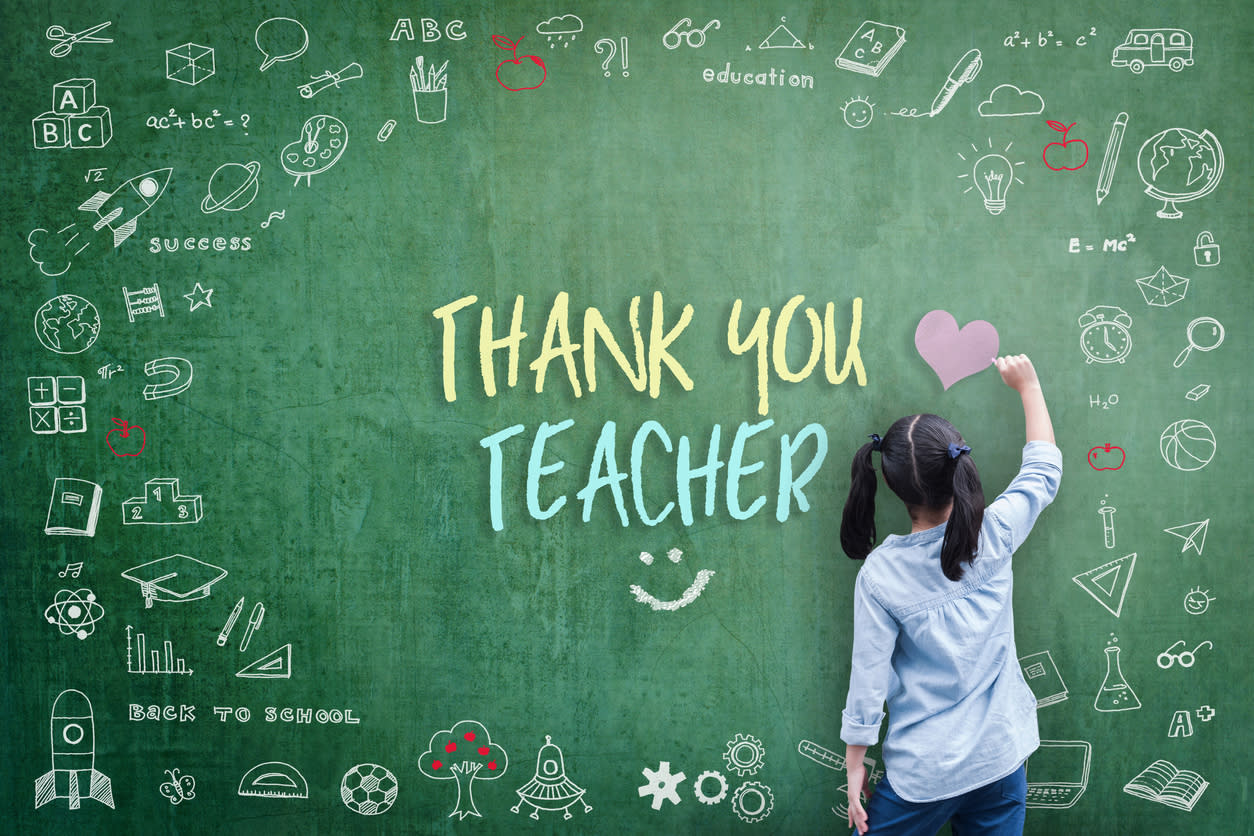 A girl at an oversized, stylised blackboard, her back to the camera, writing 'Thank you teacher'.