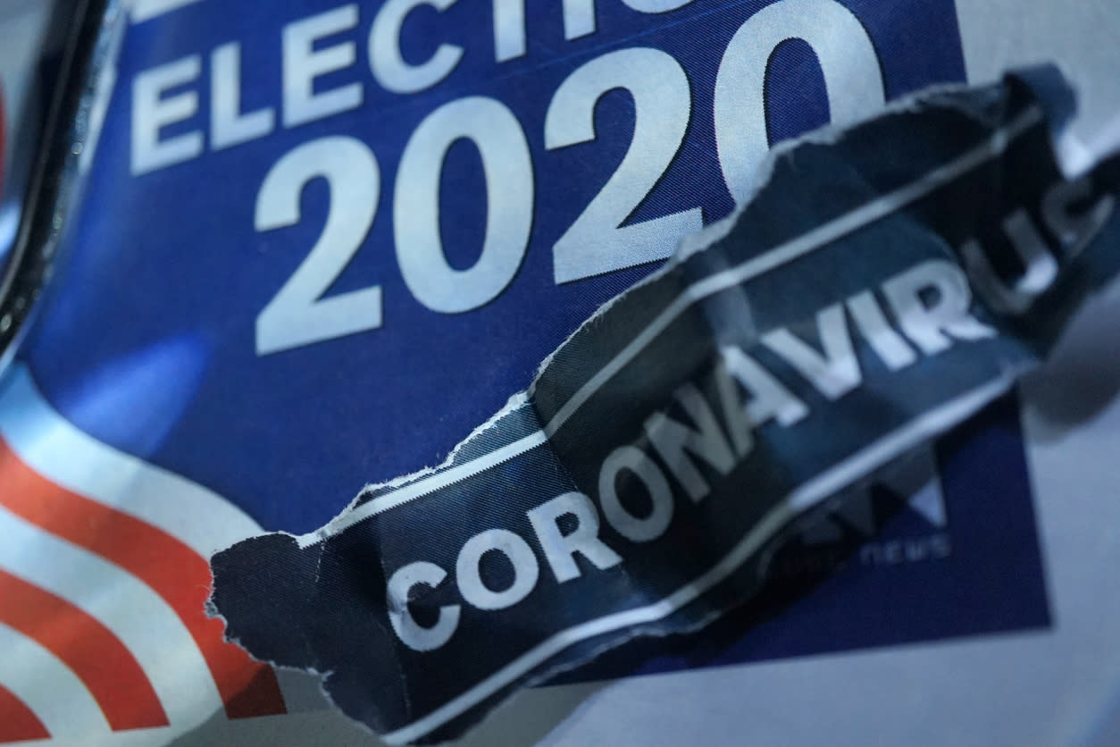 A US election 2020 banner with a crumpled piece of paper reading 'coronavirus' on top