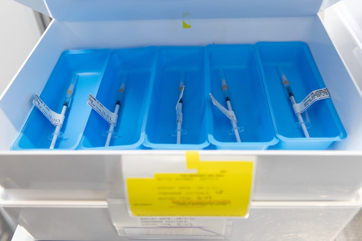 Trays of individual COVID vaccination syringes 