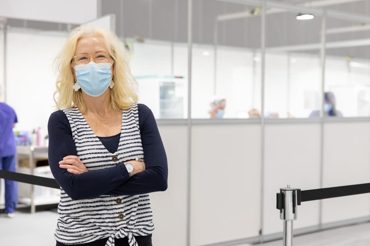 Professor Tina Brock, wearing a mask, at Royal Melbourne Hospital's vaccination hub