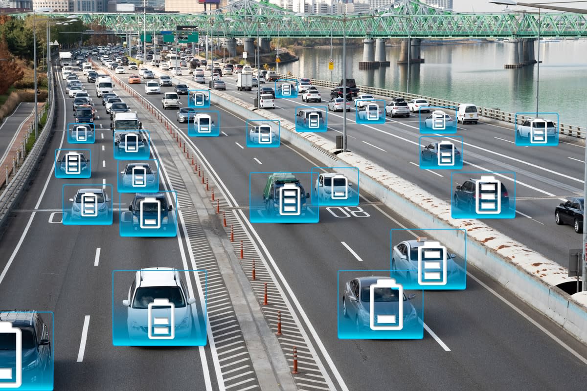 Cars on a free with electric battery indicators superimposed on them