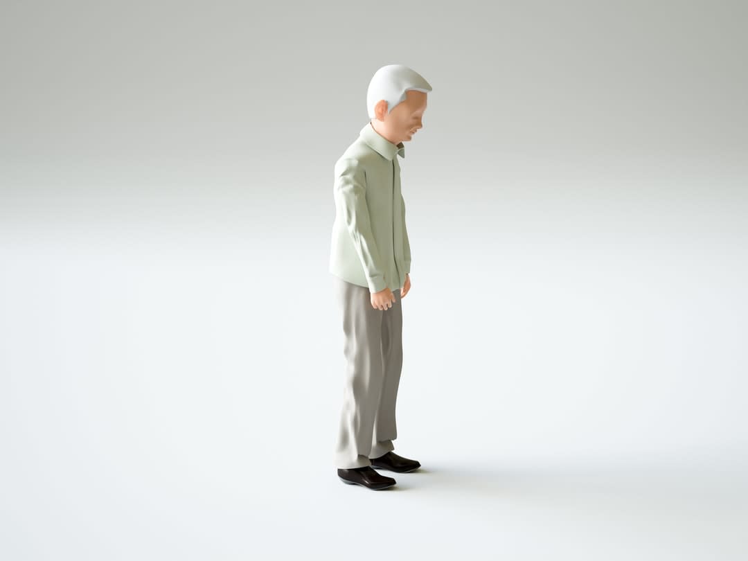 Figurine of an old man standing alone.