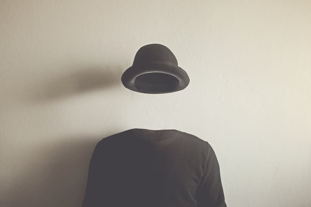 Invisible man wearing black bowler hat.