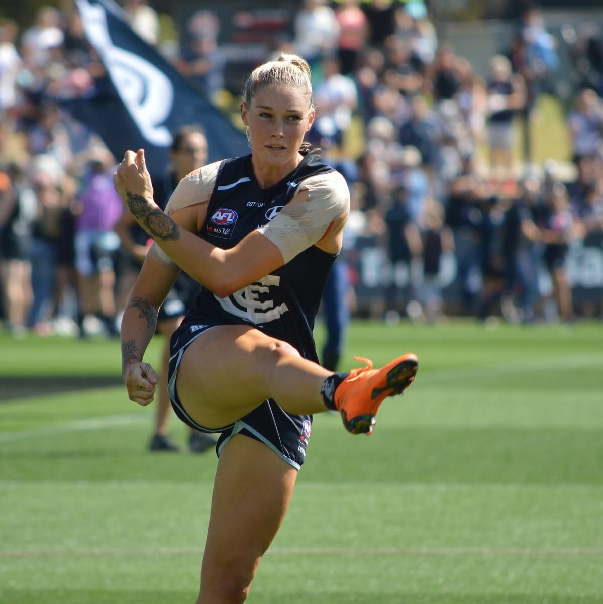 Carlton Women's AFL player Tayla Harris kicking during a game