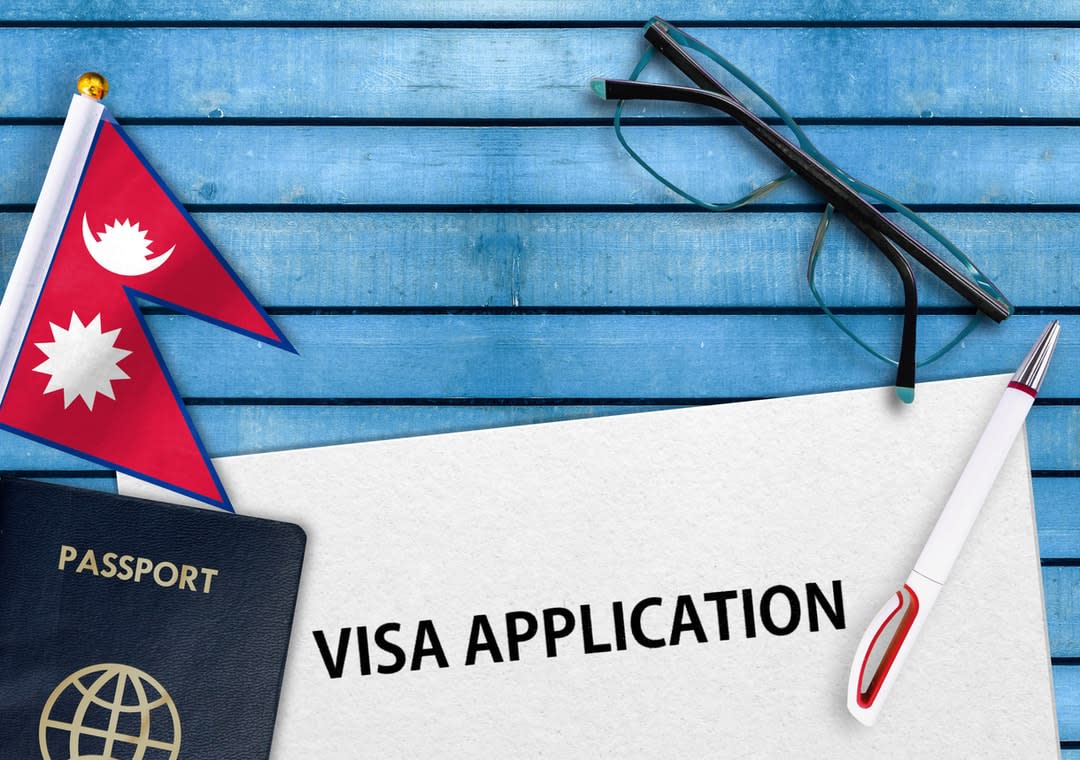 A passport, the Nepali flag and visa application concept.