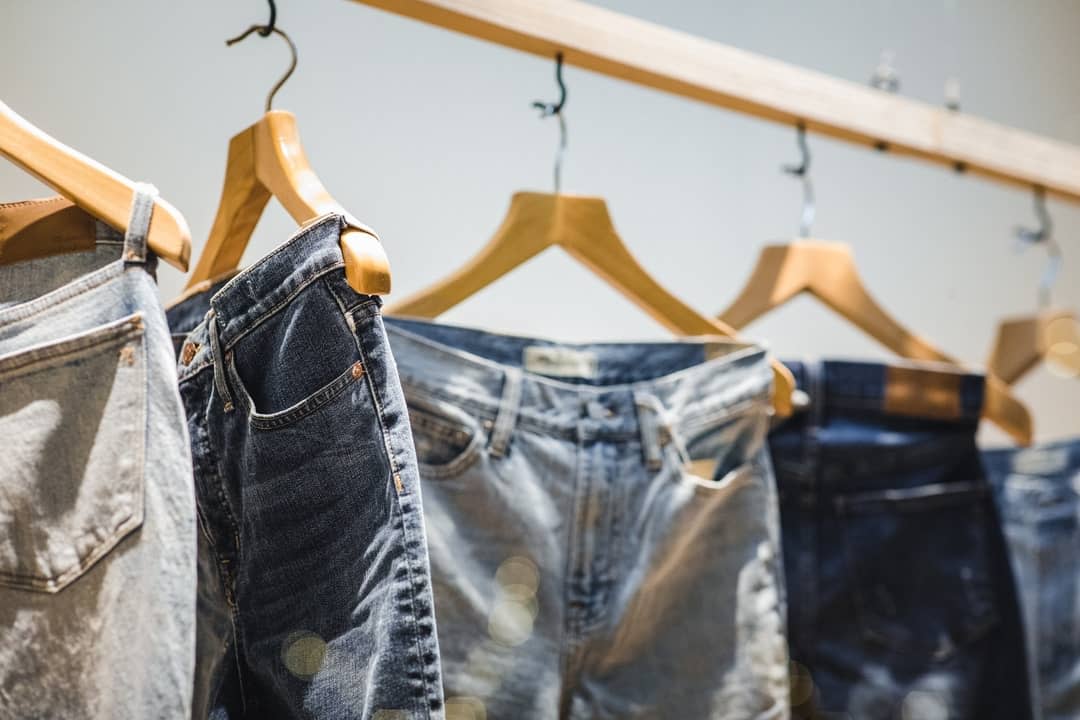 A rack of jeans for sale.