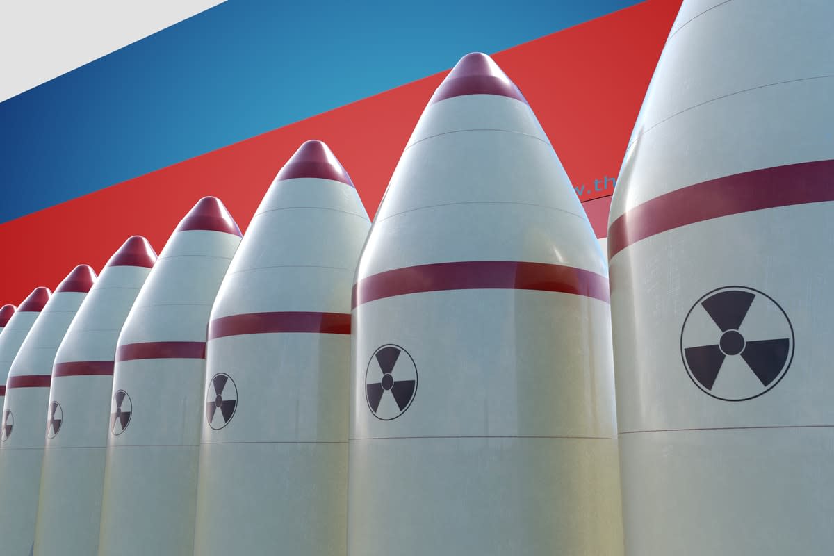 Nuclear warheads lined up in front of a Russian flag