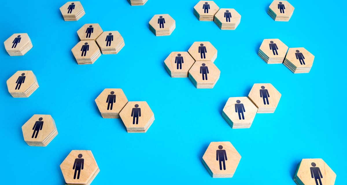 Figures of people on hexagonal blocks, depicting relationship between people and searching for job candidates