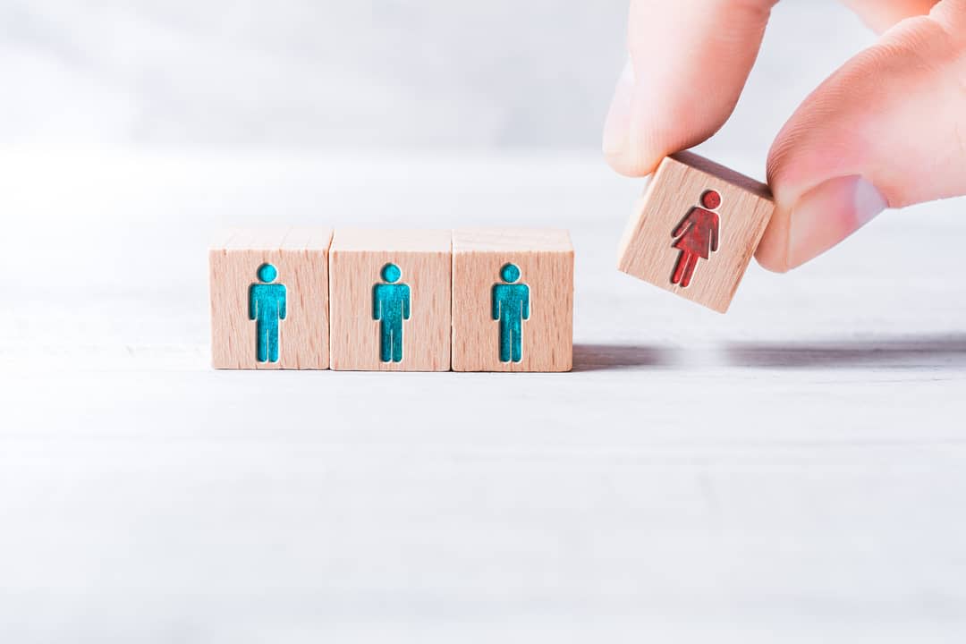 Wooden blocks of three males and one female.