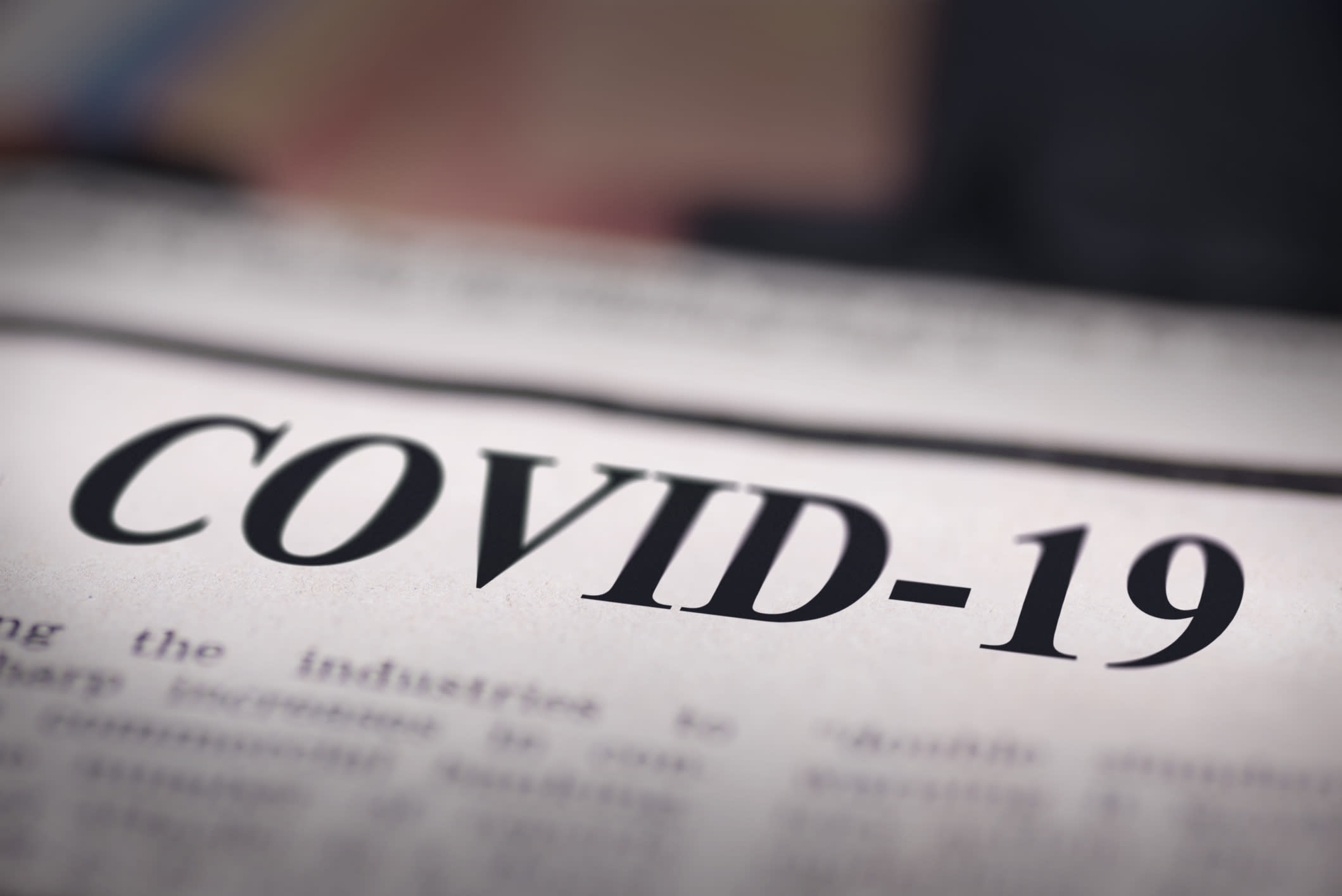 Close-up of a headline on a page reading 'COVID-19' 