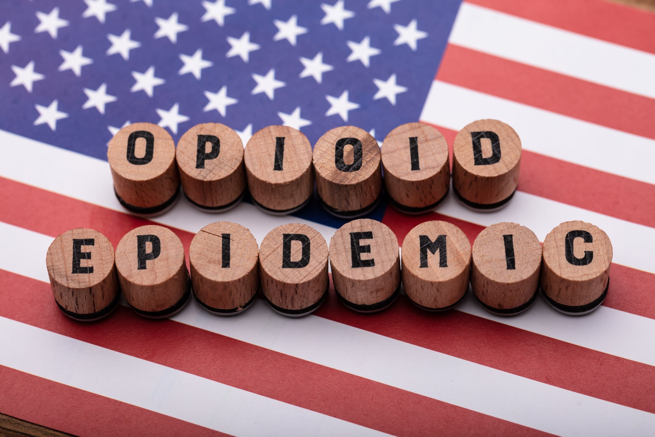 Opioid Epidemic Text On Cork Over American Flag 