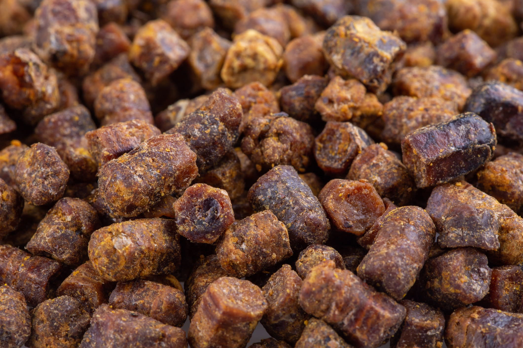 Heap of bee bread as background. Close-up.