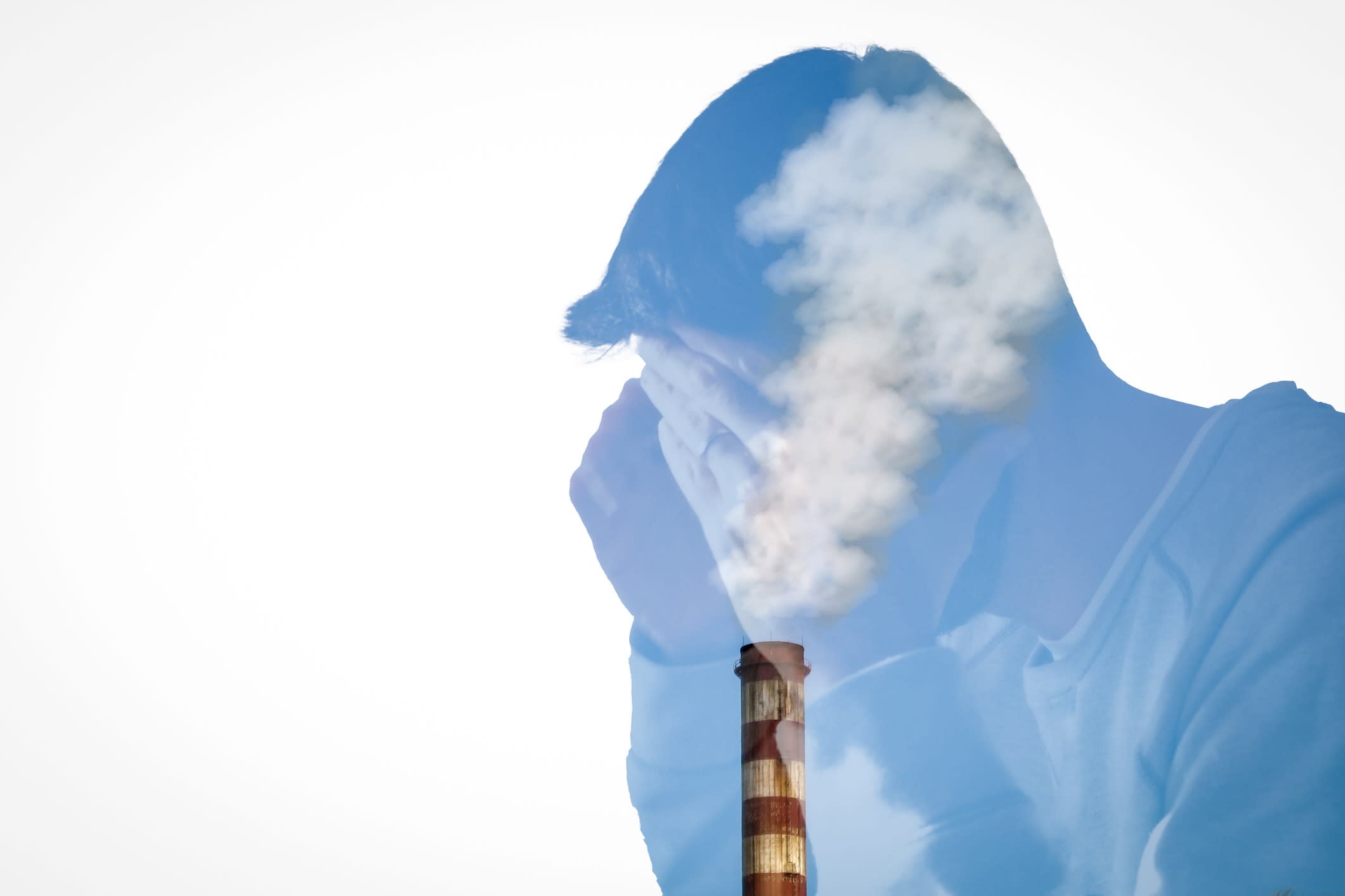 Silhouette of a Young troubled man combined with a smoky chimney