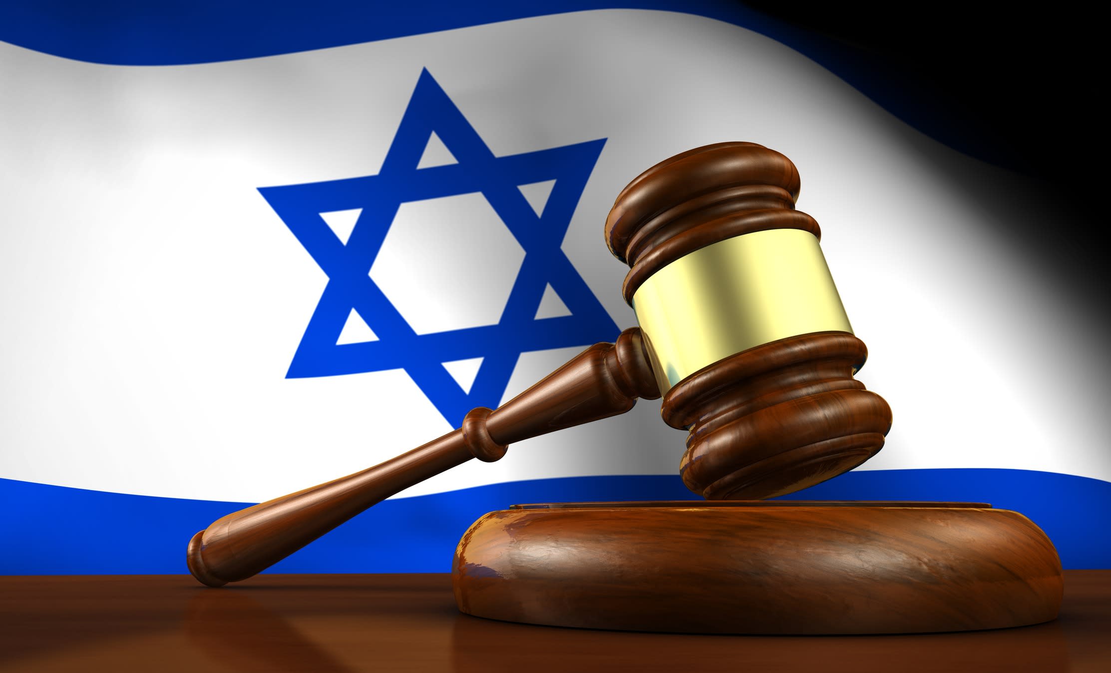 Judges gavel with Israeli flag as a backdrop.