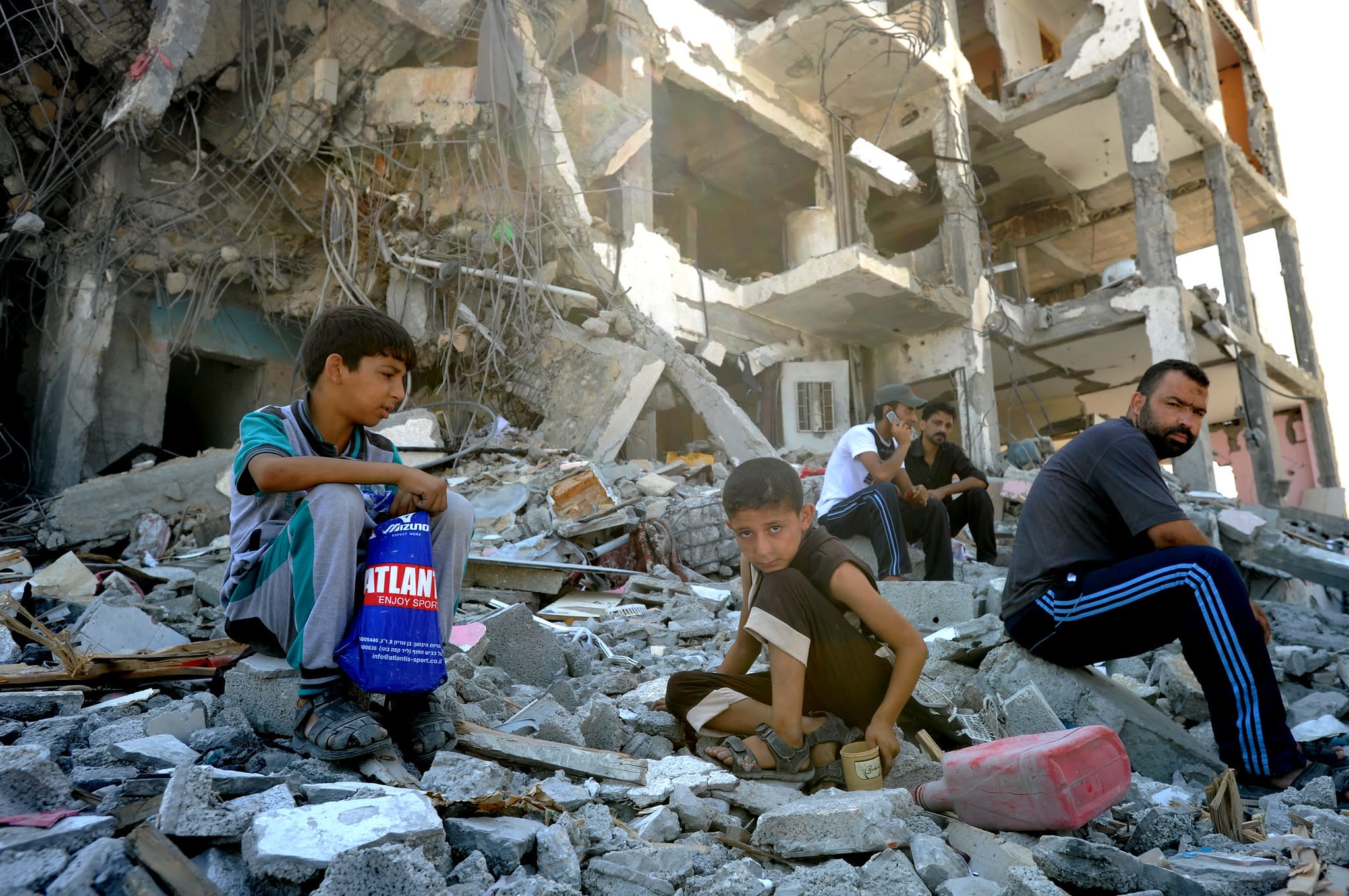 Palestinians search through the rubble of their destroyed homes hit by Israeli strikes in the northern Gaza Strip.